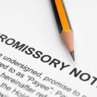 What should be included in a promissory note?